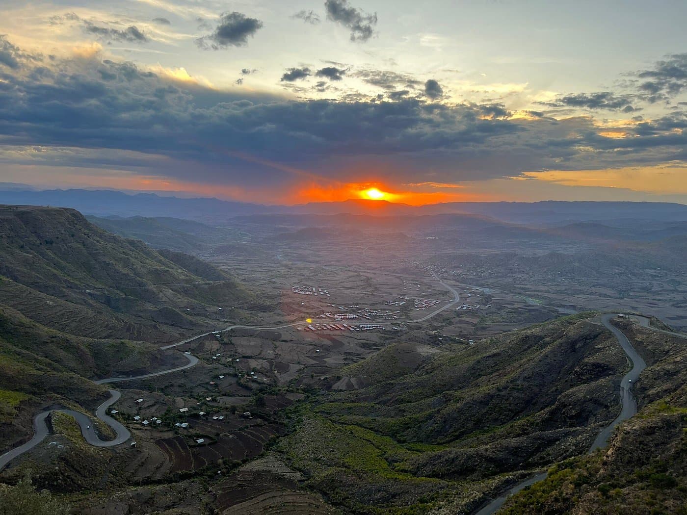 Aerial sunset view over the winding roads and valley near Lalibela, Ethiopia