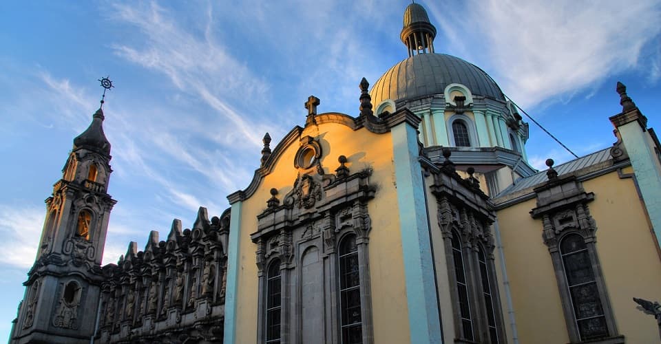 Historic domed cathedral in Addis Ababa lit by golden hour light