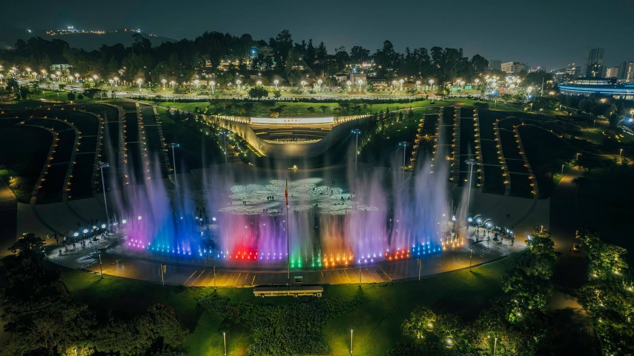 Illuminated colorful musical dancing fountains at Friendship Park in Addis Ababa at night