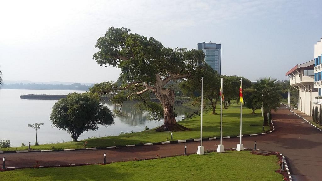 Lakeside park with large shade tree and flags overlooking Lake Tana in Bahir Dar, Ethiopia