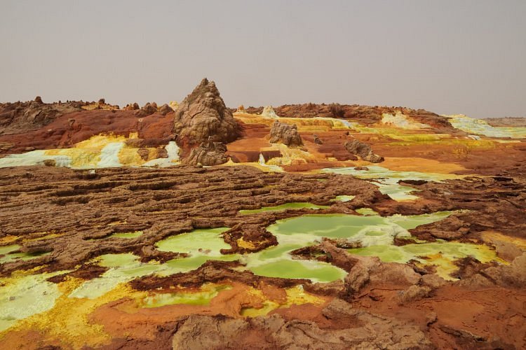 Vivid yellow and green mineral terraces at the Dallol geothermal field, Ethiopia