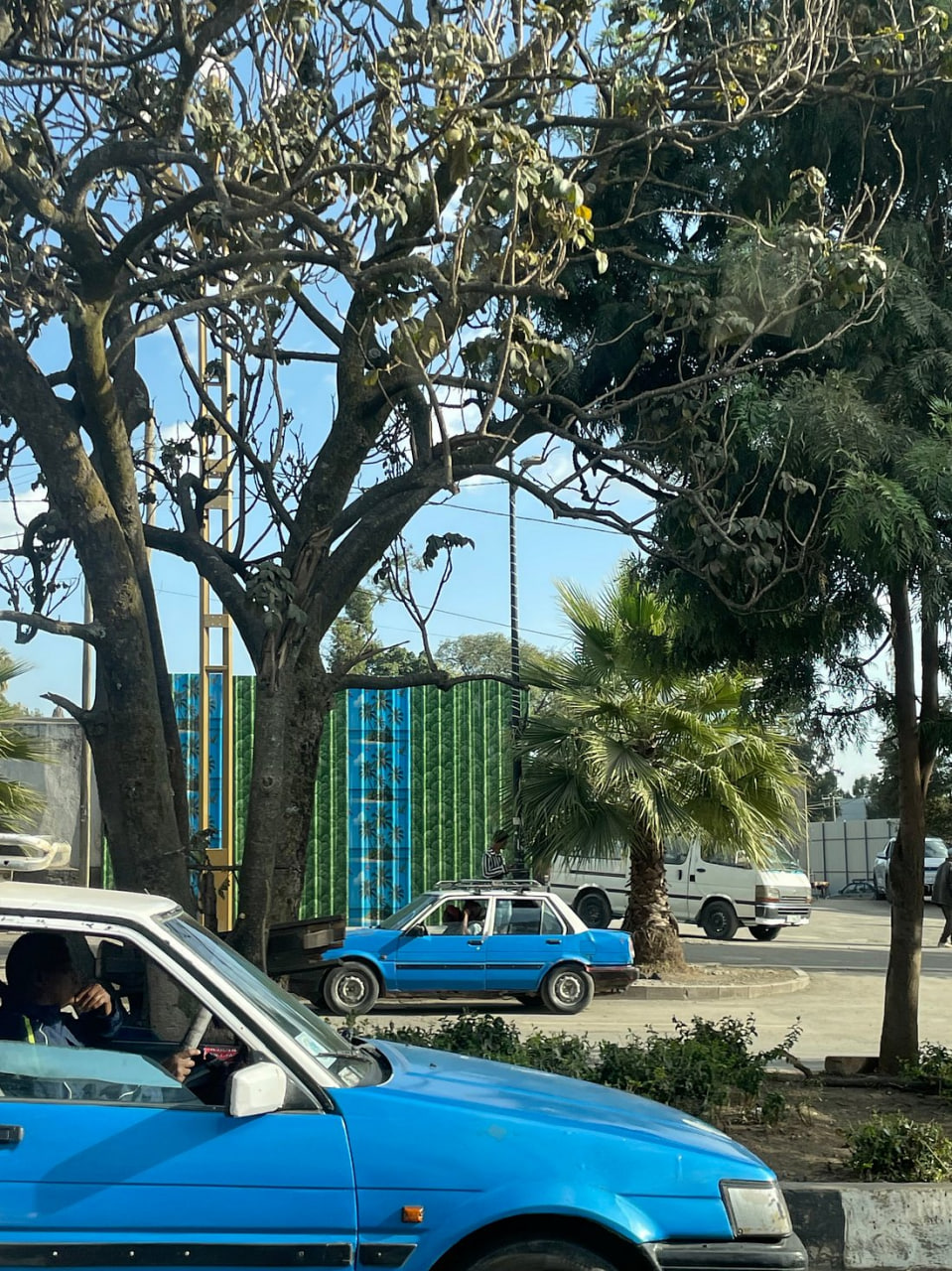 Blue taxis and street life in a small Ethiopian town