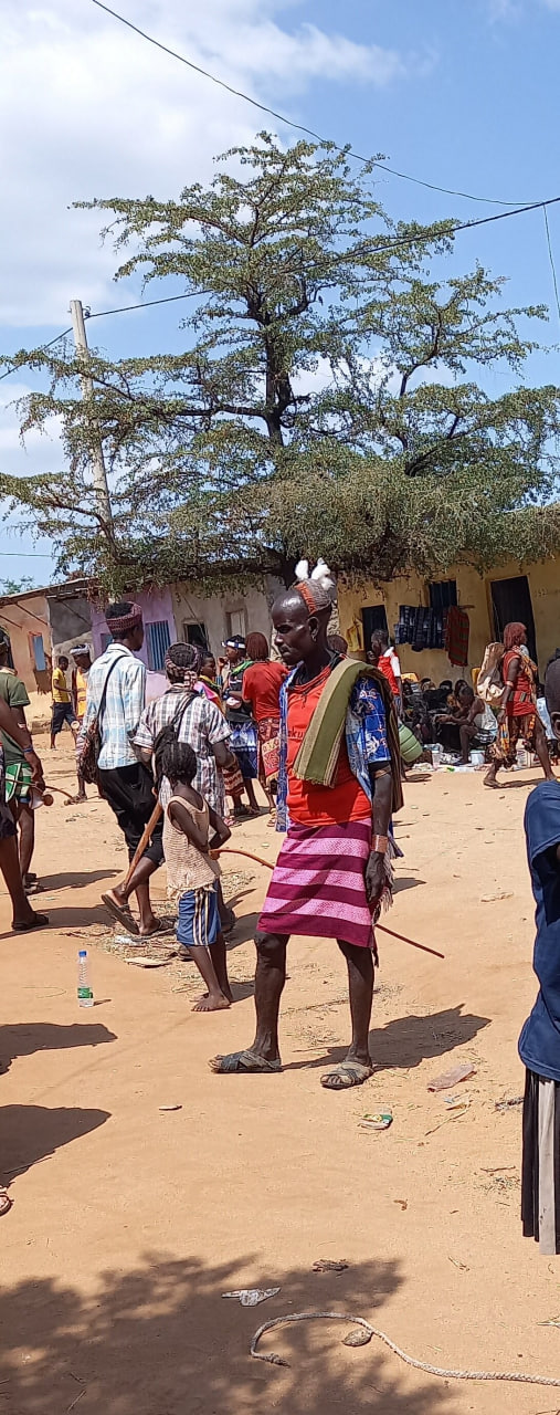 Local man in traditional dress and headpiece at a South Omo market, Ethiopia