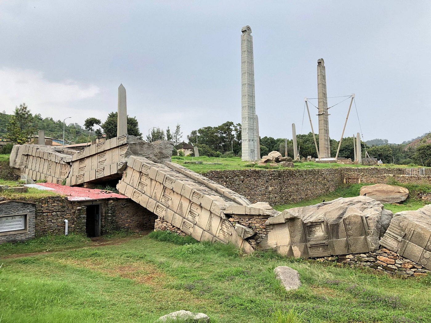 Ancient fallen obelisk and standing stelae at the Aksum Stelae Park