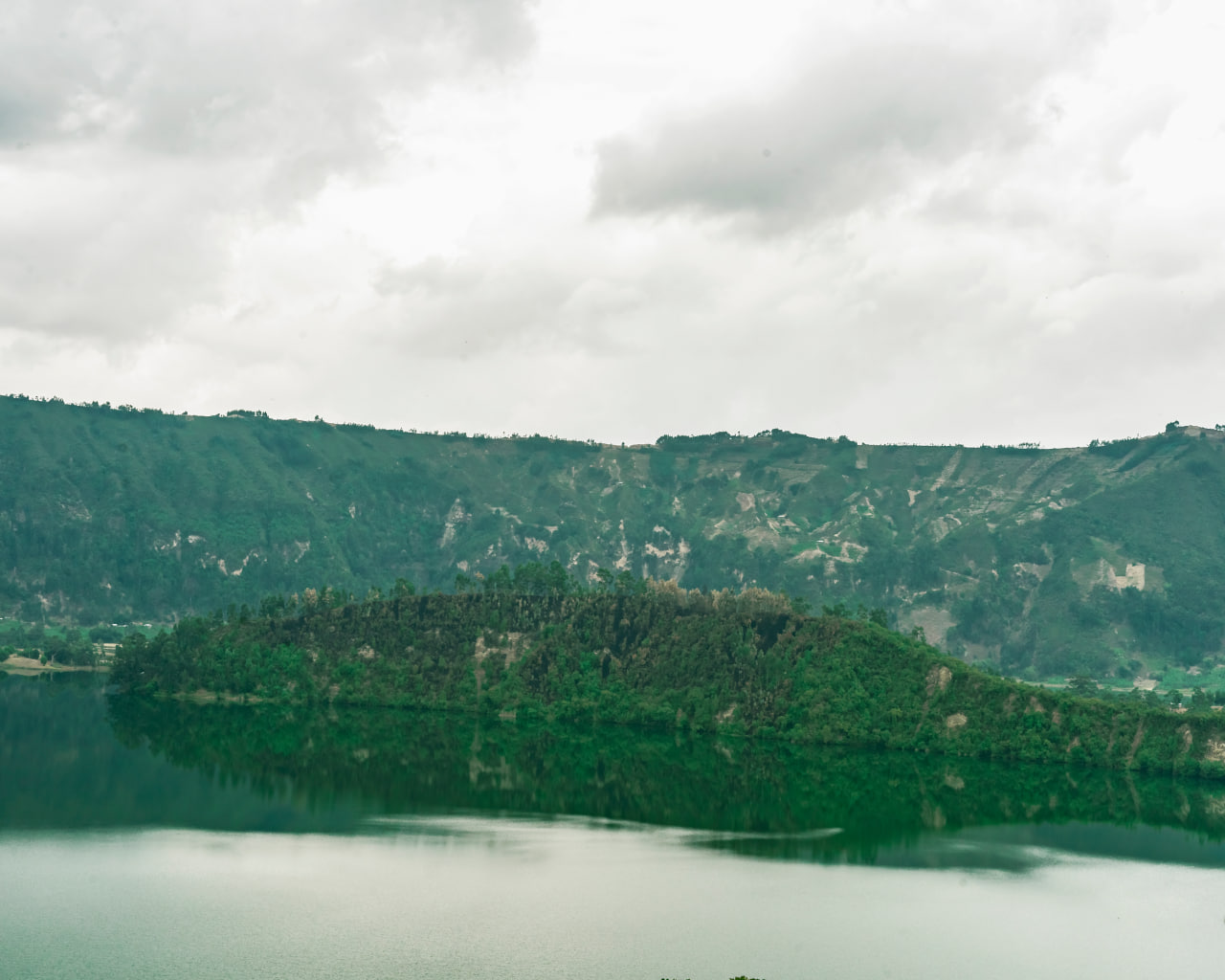 Scenic crater lake surrounded by green highlands, Ethiopia