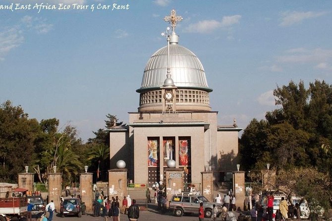 Front gate and dome of Debre Libanos Monastery with visitors gathered outside