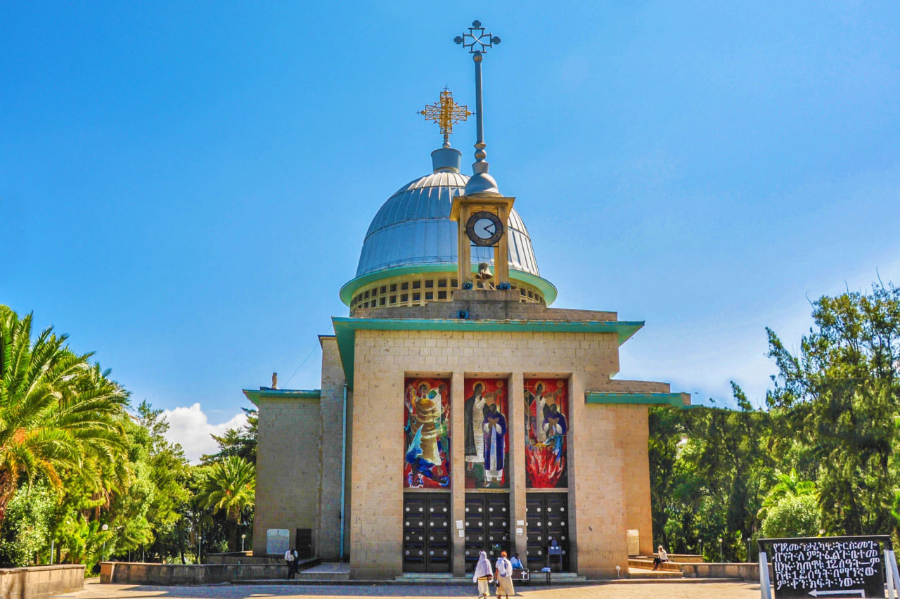 Debre Libanos Monastery's domed clock tower and colorful mosaic facade