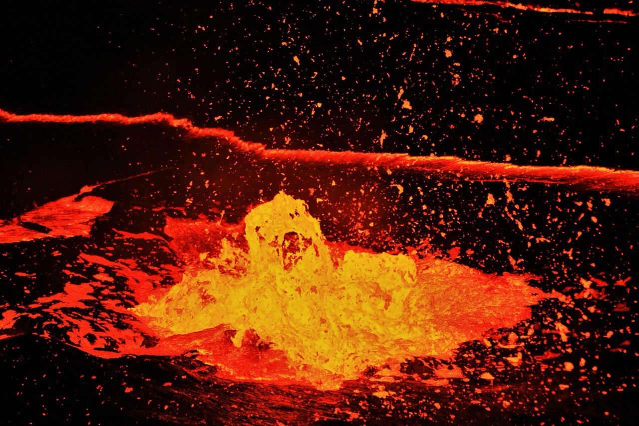 Splashing molten lava at the Erta Ale volcano crater in the Danakil Depression