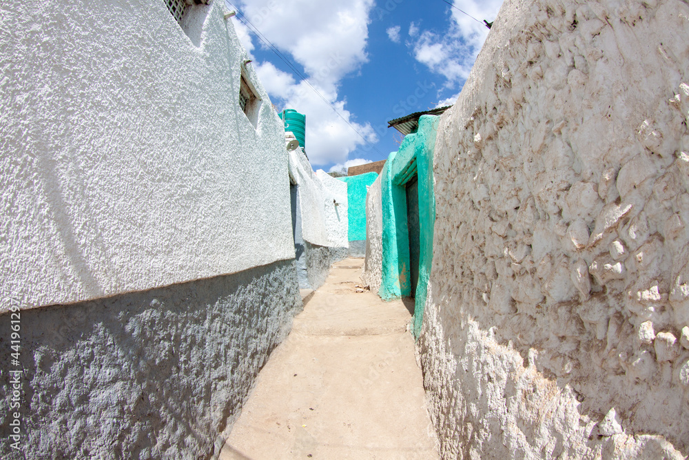 Narrow alley between whitewashed walls in Harar's old town, Ethiopia