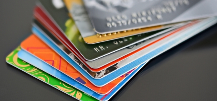 Stack of colorful credit and debit cards for travel payments
